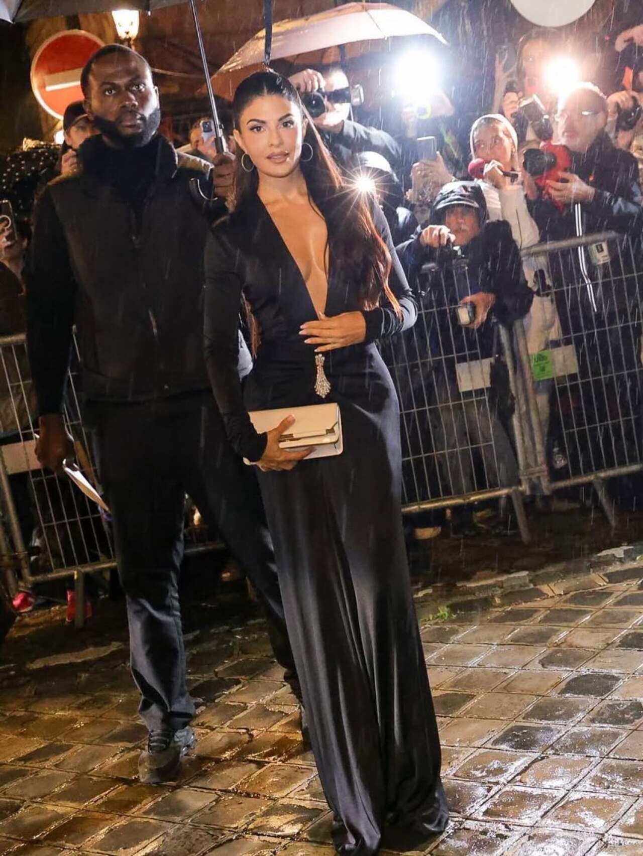 Jacqueliene paired her look with a minimalist clutch, letting the outfit’s sleek lines and subtle embellishments speak for themselves. Her hair, styled perfectly to complement the ensemble, added a touch of modern elegance to the overall look, while her poised demeanor radiated confidence on the international stage